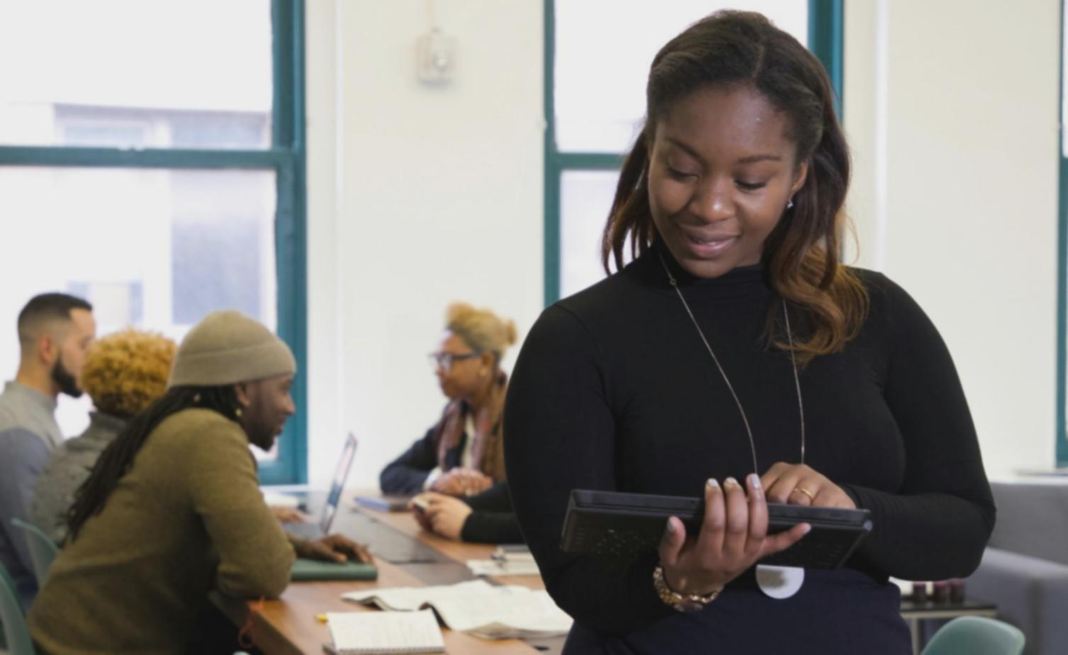 Financial analyst reviewing market data and trends on multiple screens
